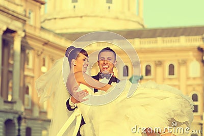 Beautiful bride and groom in city