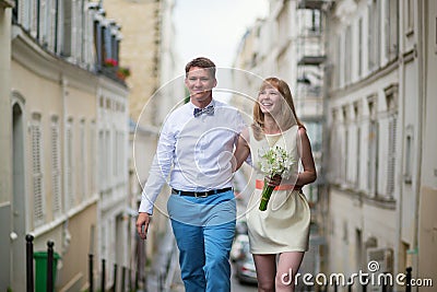 Beautiful bride and groom walking in Paris