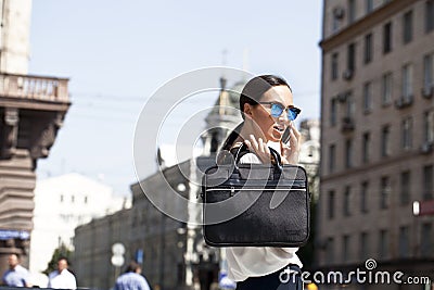 Beautiful business woman calling by phone