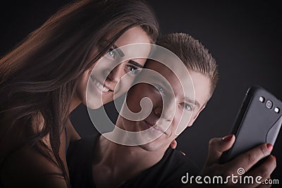 Beautiful couple with mobile phone