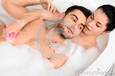 Beautiful couple is taking a bath