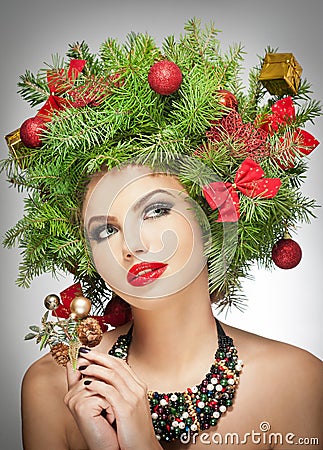 Beautiful creative Xmas makeup and hair style indoor shoot. Beauty Fashion Model Girl. Winter. Beautiful fashionable in studio