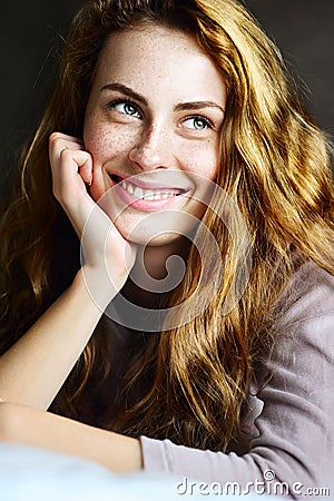 Beautiful and cute girl smiling on bed