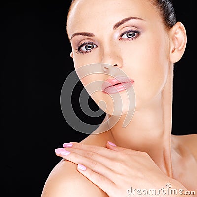 Beautiful face of the adult woman with fresh skin