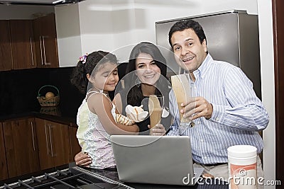 Beautiful family cooking in kitchen