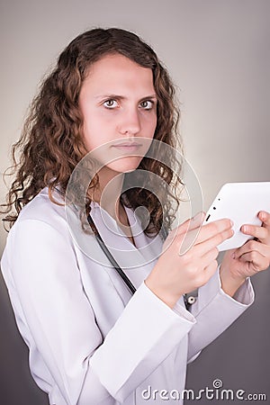 Beautiful female healthcare worker using tablet computer