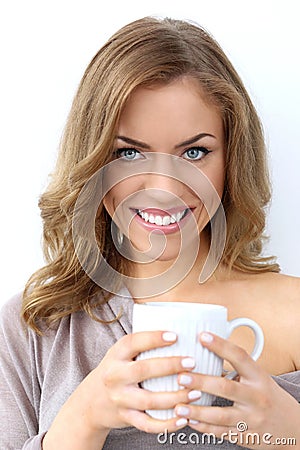 Beautiful girl with cup of tea