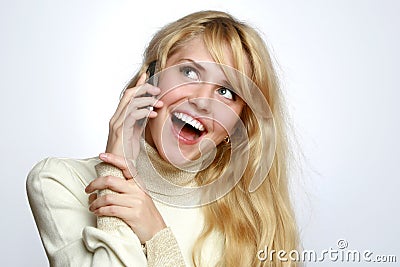 Beautiful girl speaks on a mobile telephone