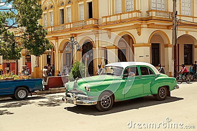 Beautiful green retro car in cuban town
