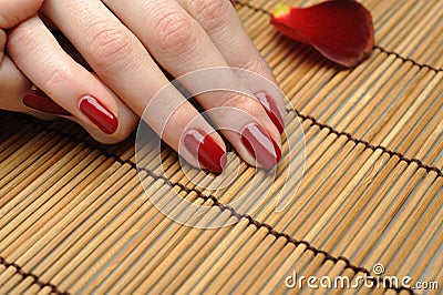 Beautiful hand with perfect nail red manicure