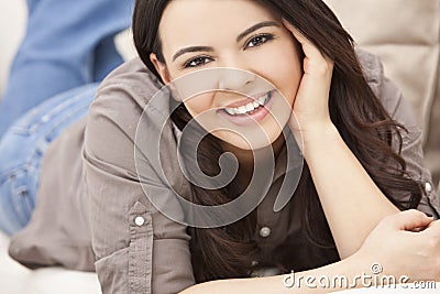 Beautiful Hispanic Woman Laying on Sofa Relaxing