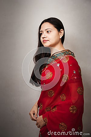 Beautiful Indian happy woman in red sari
