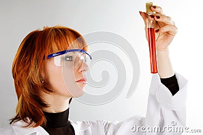 Beautiful laboratory technician with tube of blood