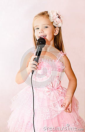 Beautiful little girl with microphone