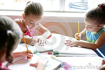 Beautiful little girls, homework at home