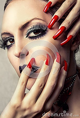 Beautiful Make-up and long red Nails