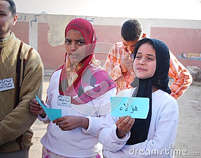 Beautiful Muslim girls holding up arabic words