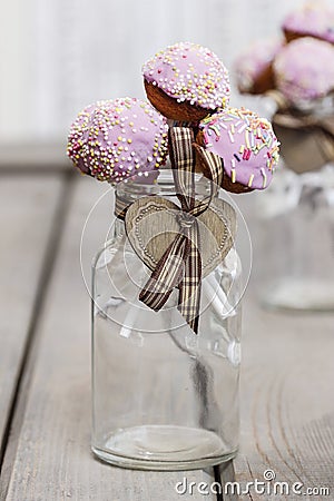 Beautiful pink cake pops decorated with sprinkles