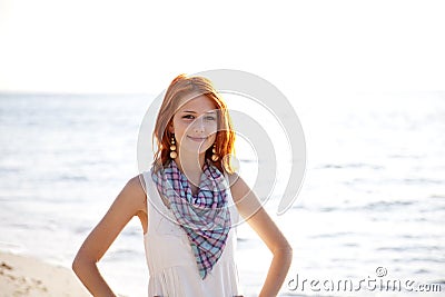 http://thumbs.dreamstime.com/x/beautiful-red-haired-girl-sunrise-beach-15154875.jpg
