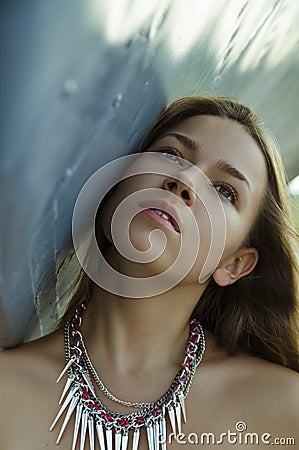 Beautiful romantic girl with decoration on neck