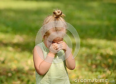 Beautiful sad little girl crying