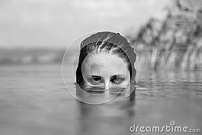 Beautiful savage girl in the river.