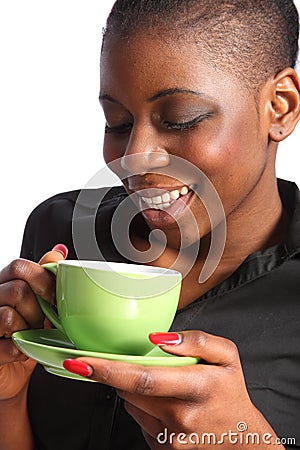 Beautiful smiling black woman drinking cup of tea