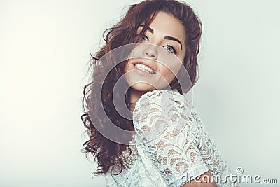 Beautiful smiling girl with natural makeup and loose hair.