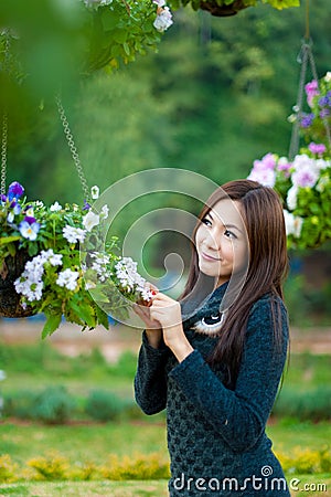 http://thumbs.dreamstime.com/x/beautiful-south-east-asian-girl-flowers-23775133.jpg