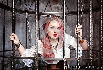 Beautiful steampunk woman in the cage