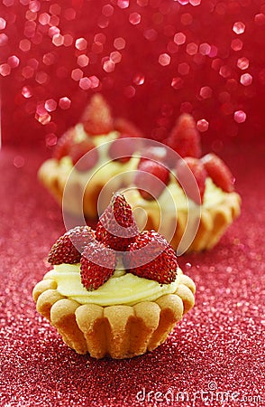 Beautiful tiny cupcakes with wild strawberries