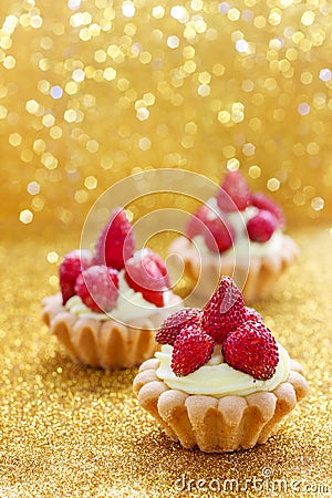 Beautiful tiny cupcakes with wild strawberries