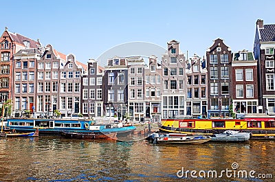 Beautiful view of Amsterdam canals with bridge and typical dutch