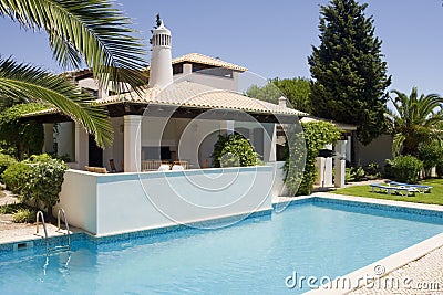 Beautiful villa with a healthy garden and a pool