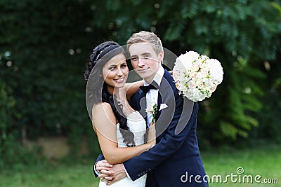 Beautiful wedding couple in the park