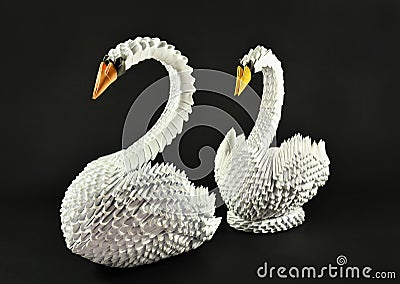 Beautiful white swans origami couple, paper made