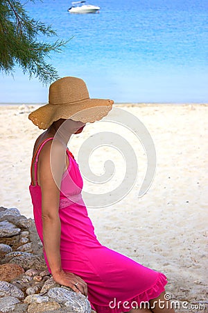 Beautiful woman by the beach in Greece