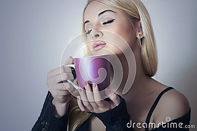 Beautiful woman drinking Coffee. Cup of tea.Delicious