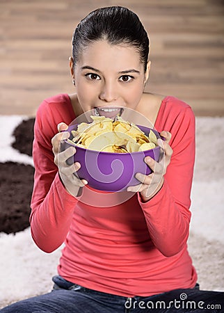 Beautiful woman eating junk food