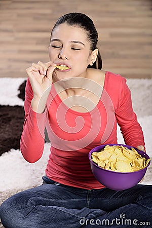 Beautiful woman eating junk food