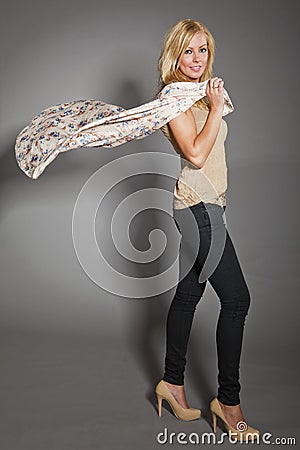 Beautiful woman with flying silk scarf