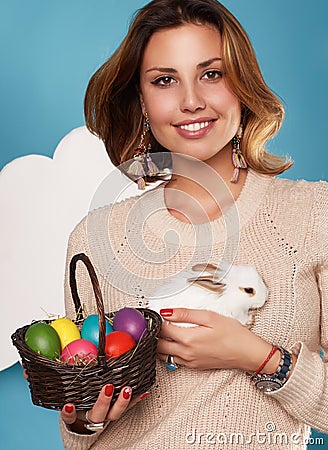 http://thumbs.dreamstime.com/x/beautiful-woman-holding-white-little-easter-bunny-basked-eggs-young-blonde-girl-smiling-wearing-beige-warm-sweater-fluffy-48265635.jpg