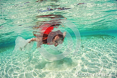 Beautiful woman lady in red swim dress water sea
