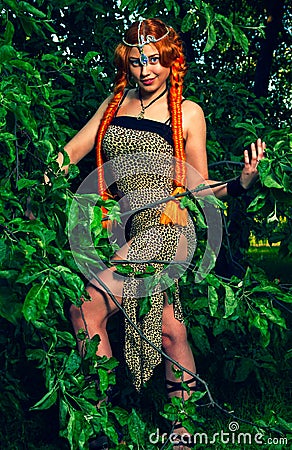 Beautiful woman in a leopard print dress