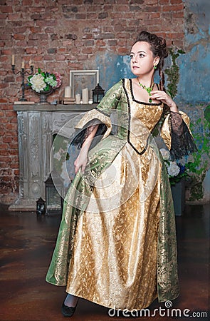 Beautiful woman in medieval dress afraid