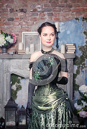 Beautiful woman in medieval dress with fan