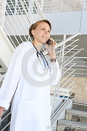 Beautiful Woman Nurse at Hospital on Stairs