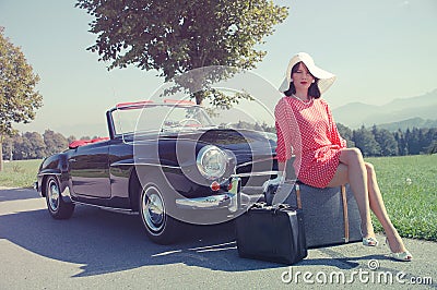 Beautiful woman and old car, sixties style