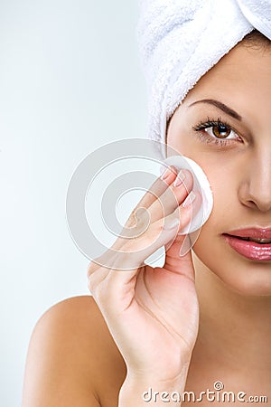 Beautiful woman with perfect skin clean face towel on her head