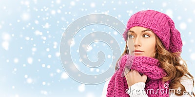 Beautiful woman in pink winter hat and muffler